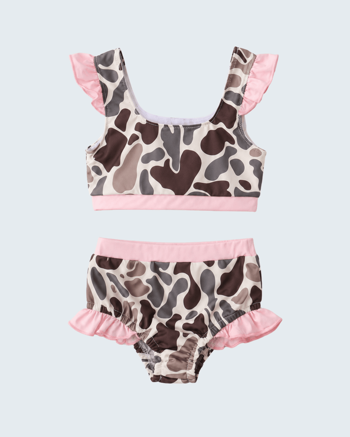 Camouflage-patterned bikini set with pink accents on a light gray background