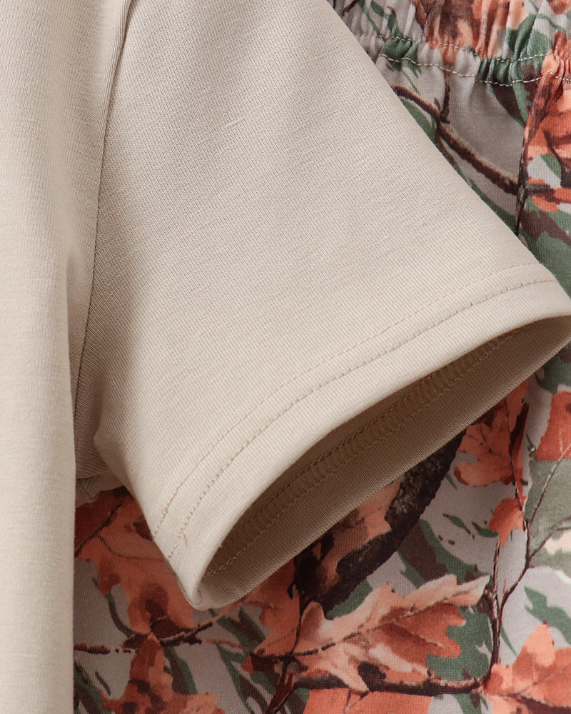 Beige shirt and camo shorts