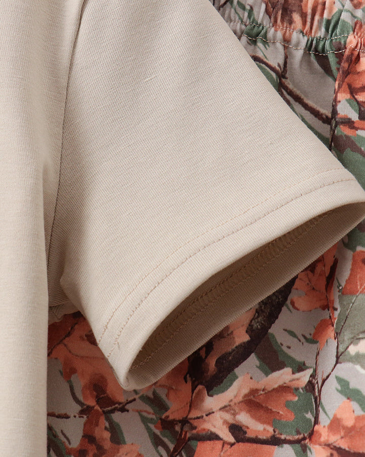 Beige shirt and camo shorts
