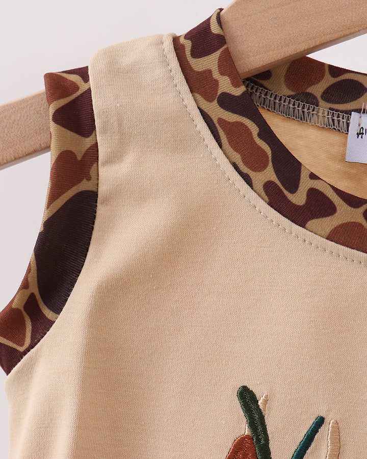 Beige romper with camouflage shoulder trim and partial embroidered duck motif