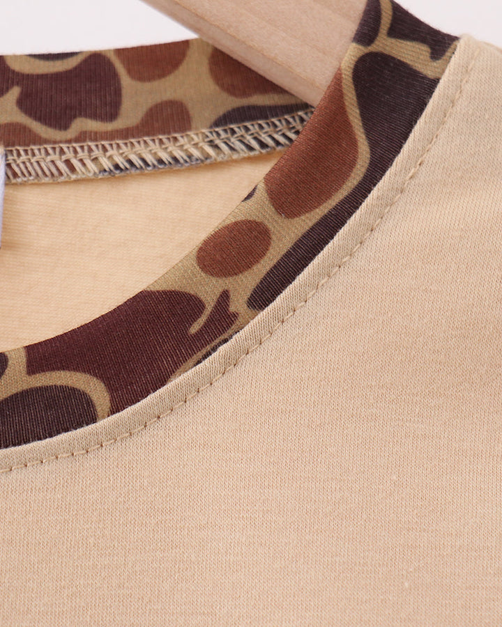 Beige crew-neck top with camouflage trim at neckline and stitched collar