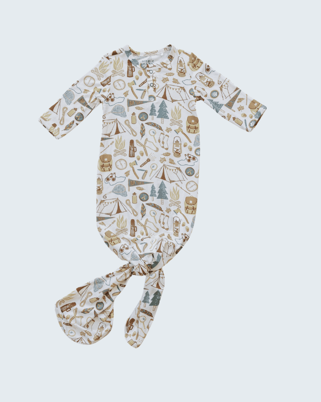 Baby onesie with nature-themed print on a white background