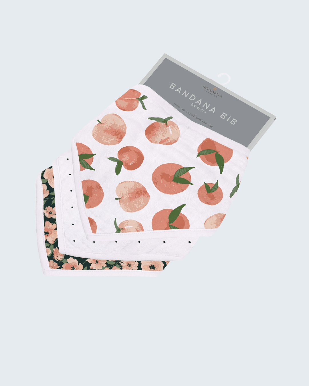 Bandana bib with peach pattern on a light gray background