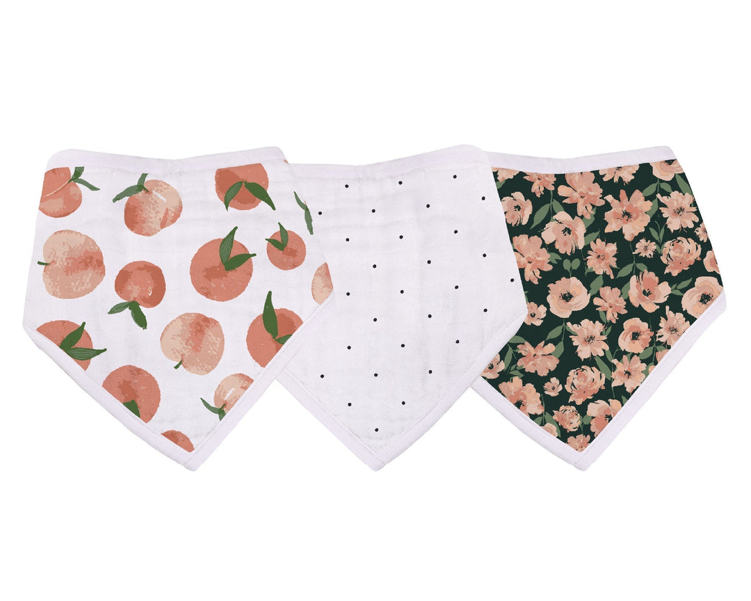 Three baby bibs with different patterns on a white background