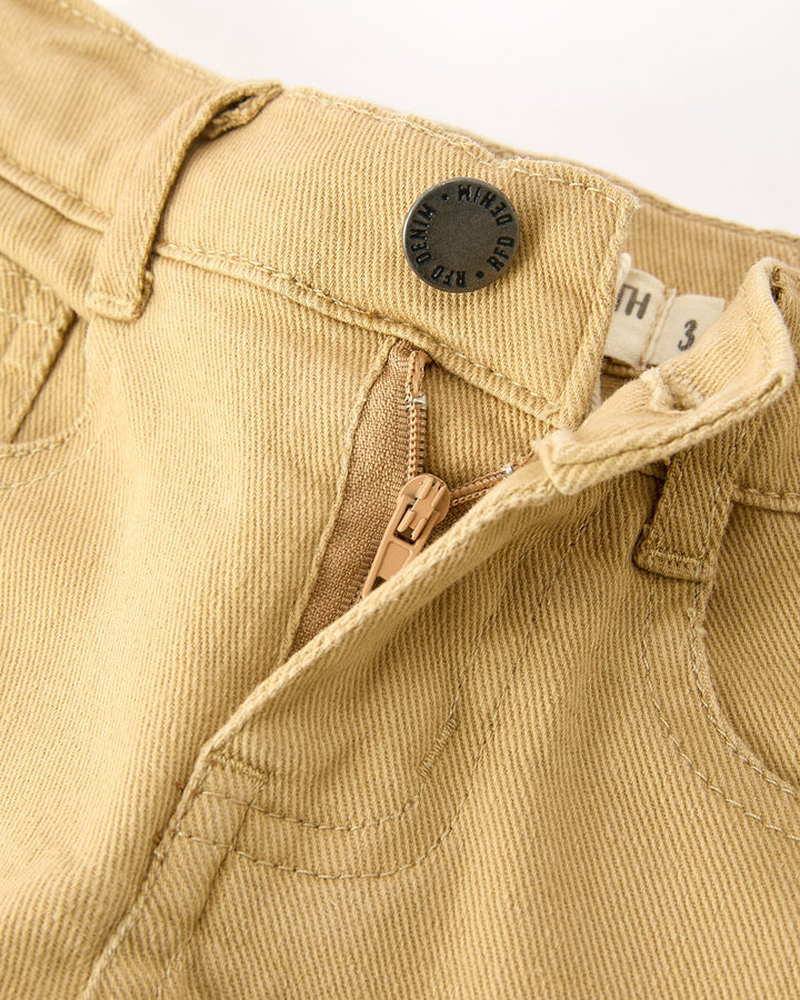 Khaki girls cargo pants waistband close-up with button and inner tag