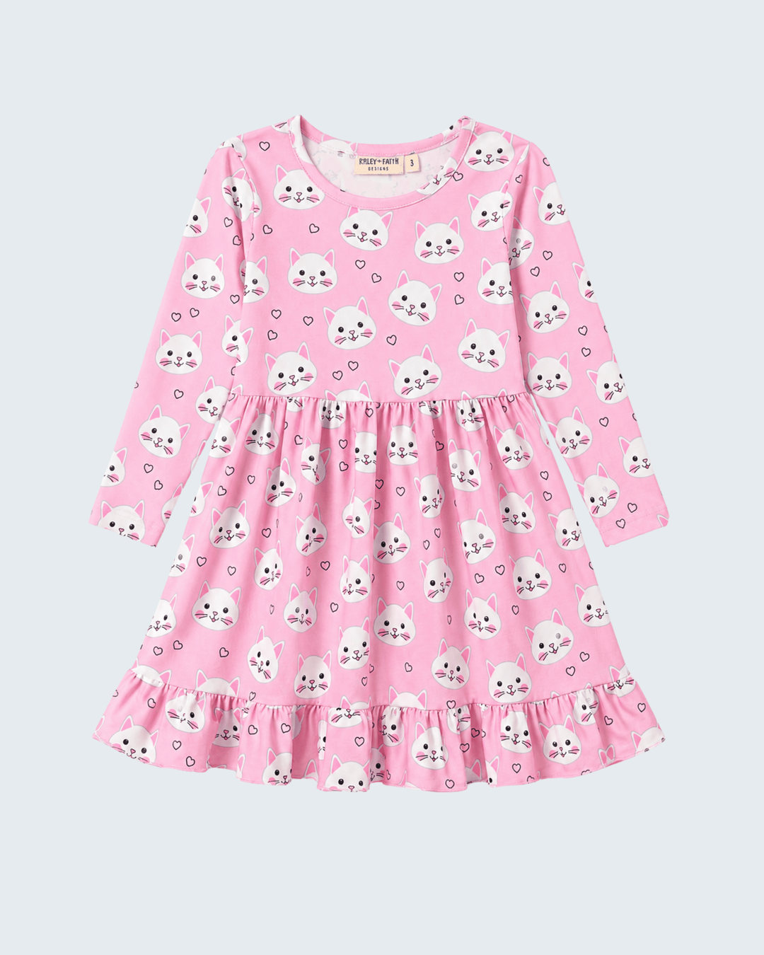 Pink dress with cat pattern on a light purple background