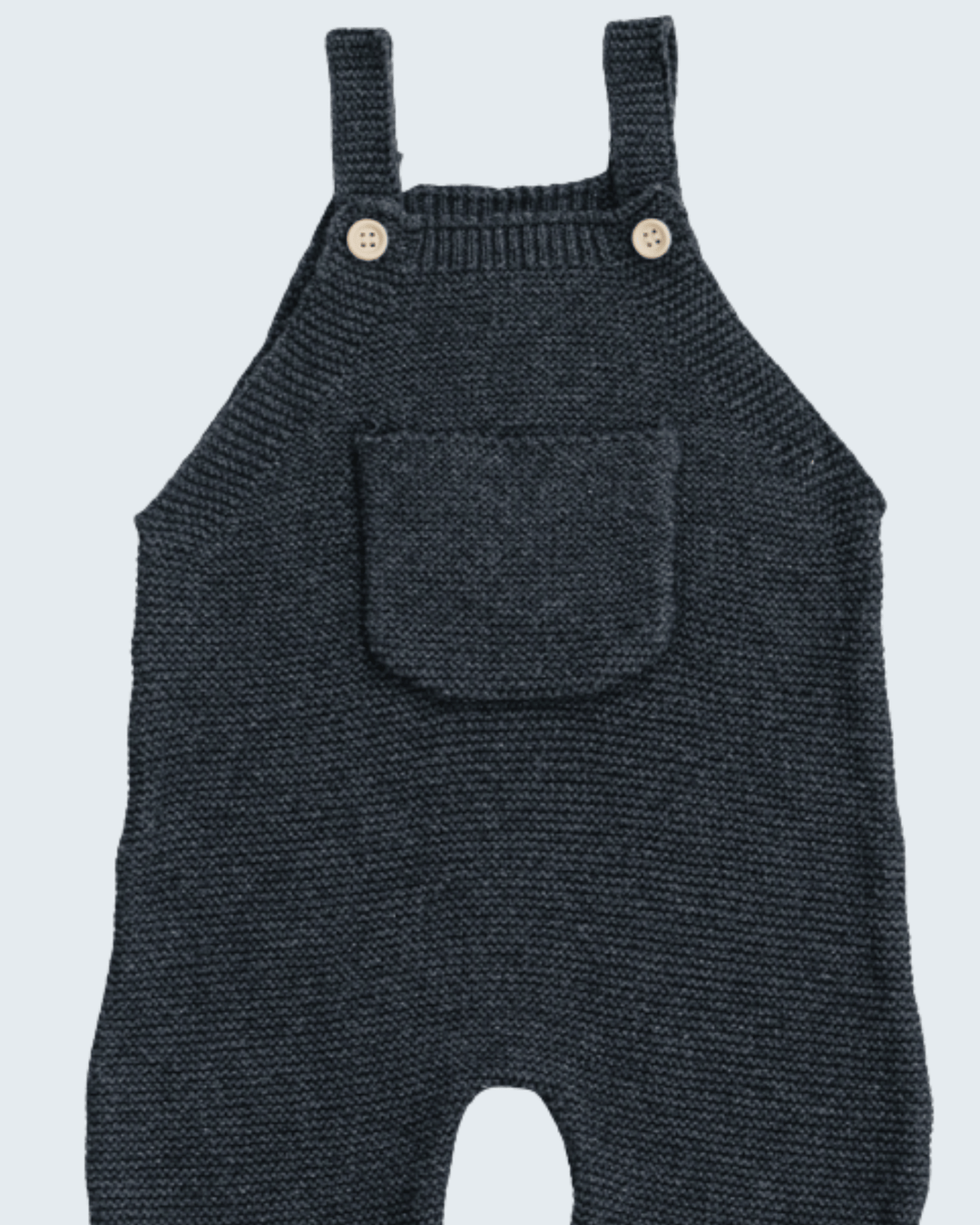 A pair of dark grey knit baby overalls with adjustable shoulder straps, two wooden buttons, and a front patch pocket, shown against a light gray background.