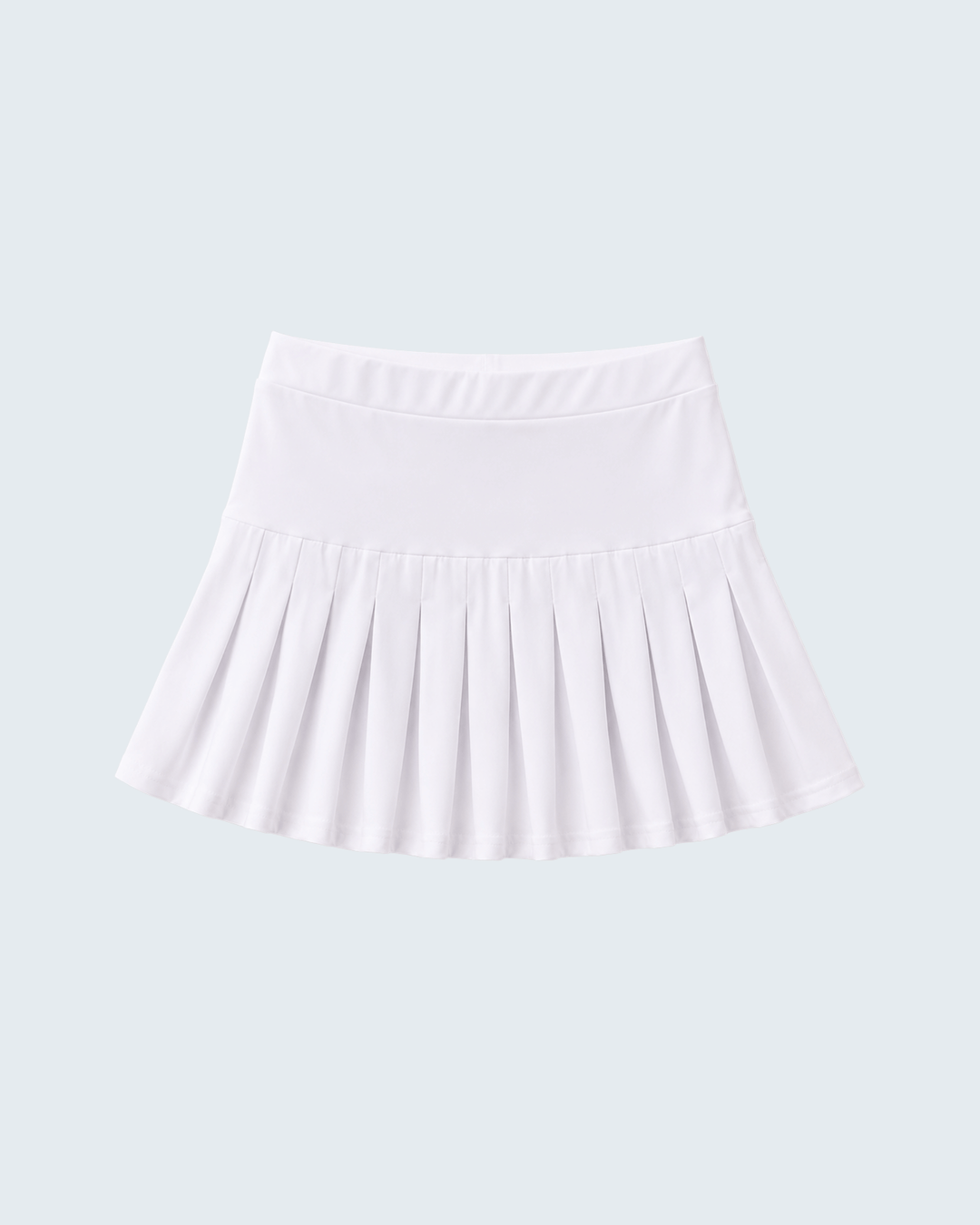 White pleated skort with wide elastic waistband and gathered ruffle hem