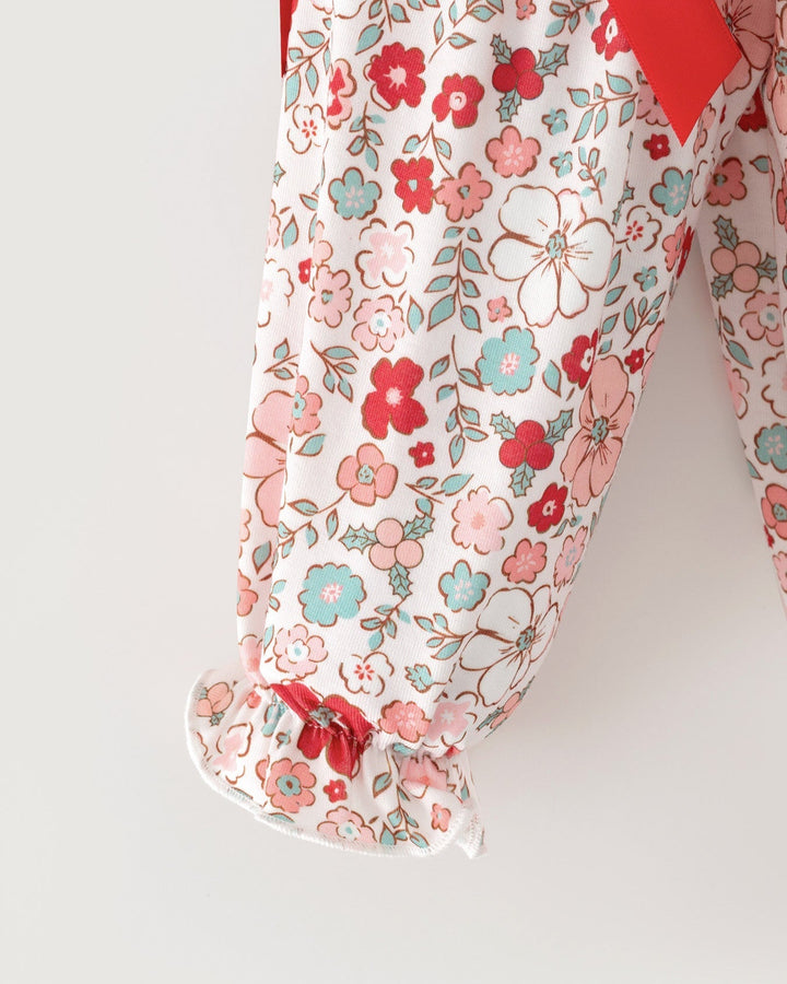 Floral baby girl long-sleeve top hem with scalloped edge and bow shoulder detail