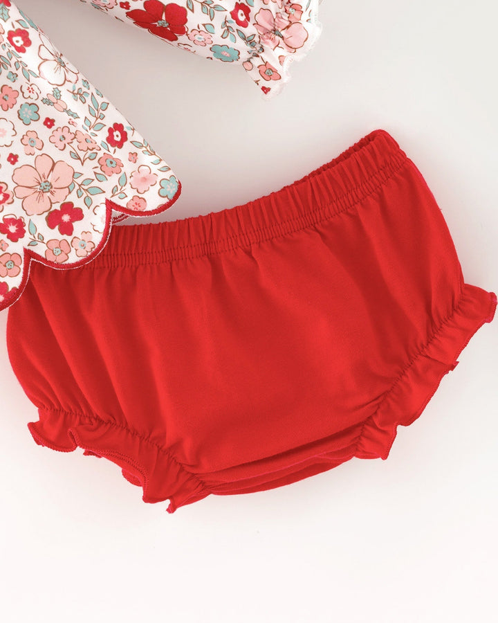 Red baby girl bloomer shorts with elastic waistband and gathered ruffle edges