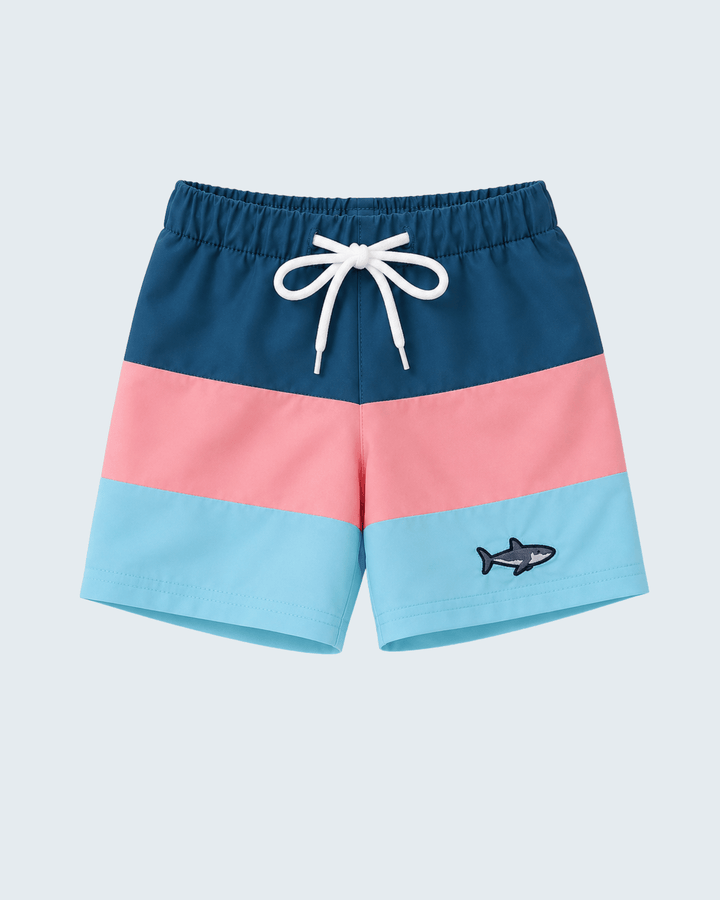 Color-blocked shorts with a shark design on a light blue background