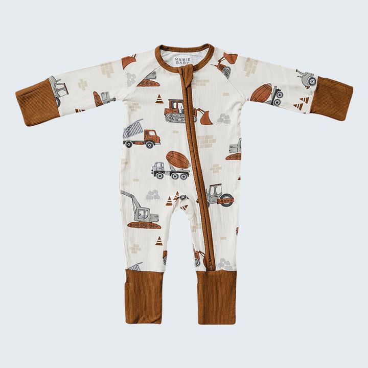 Baby onesie with construction vehicle pattern on a light blue background