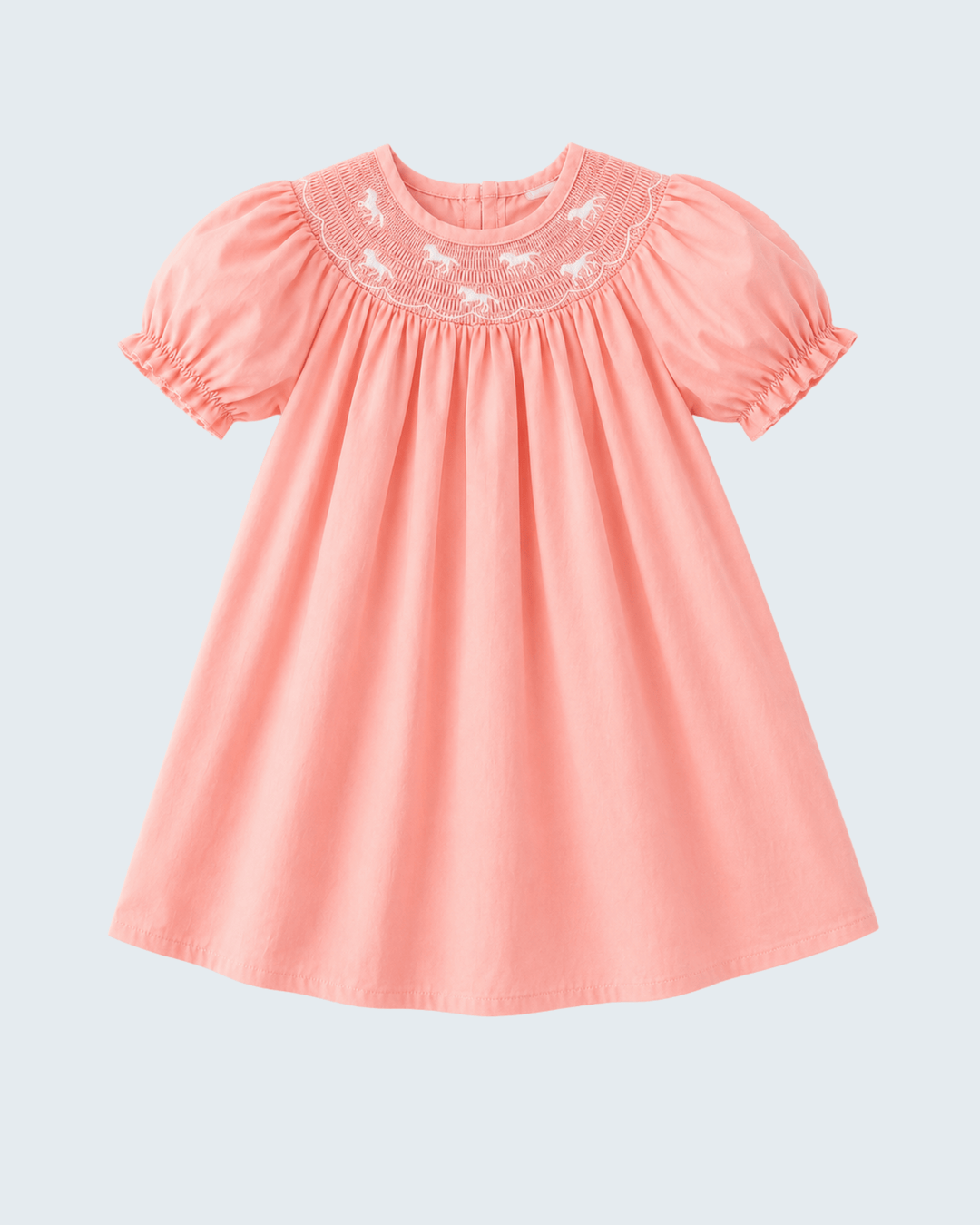 Pink dress with embroidery on a light gray background