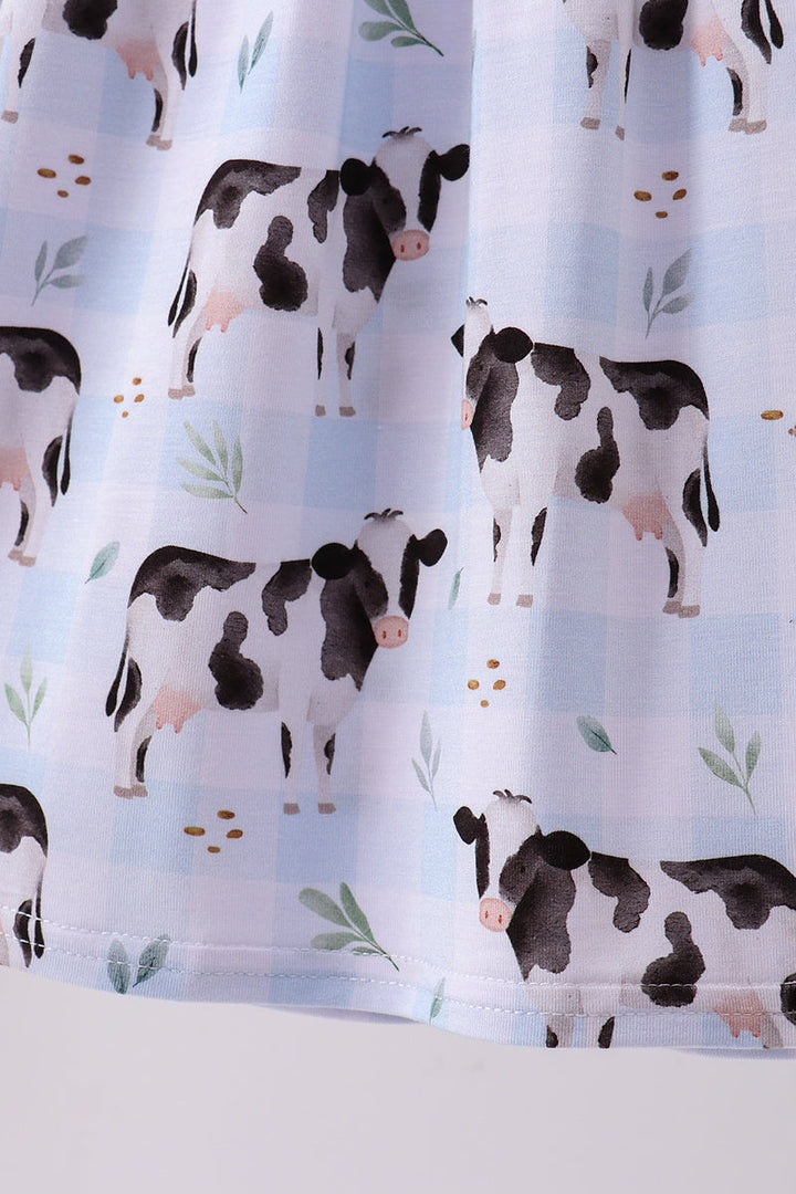 Dress with cow pattern on a light blue background