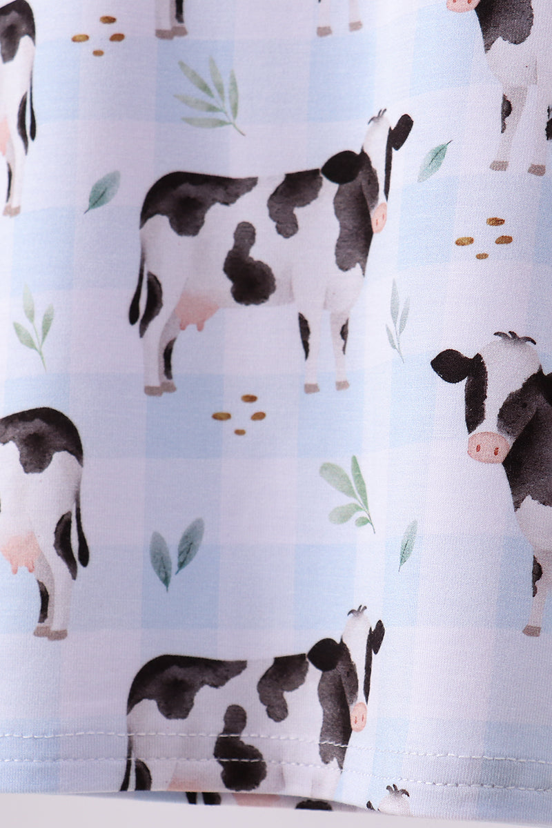 Boys Pajamas with cow pattern on a light blue background