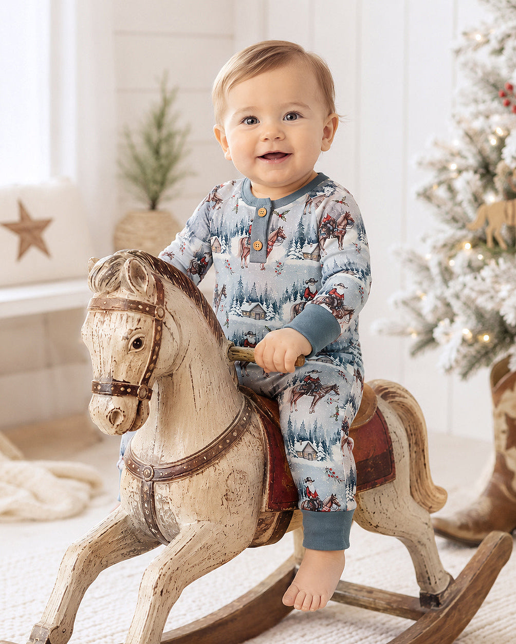 Light blue cowboy-print long-sleeve henley romper with button placket
