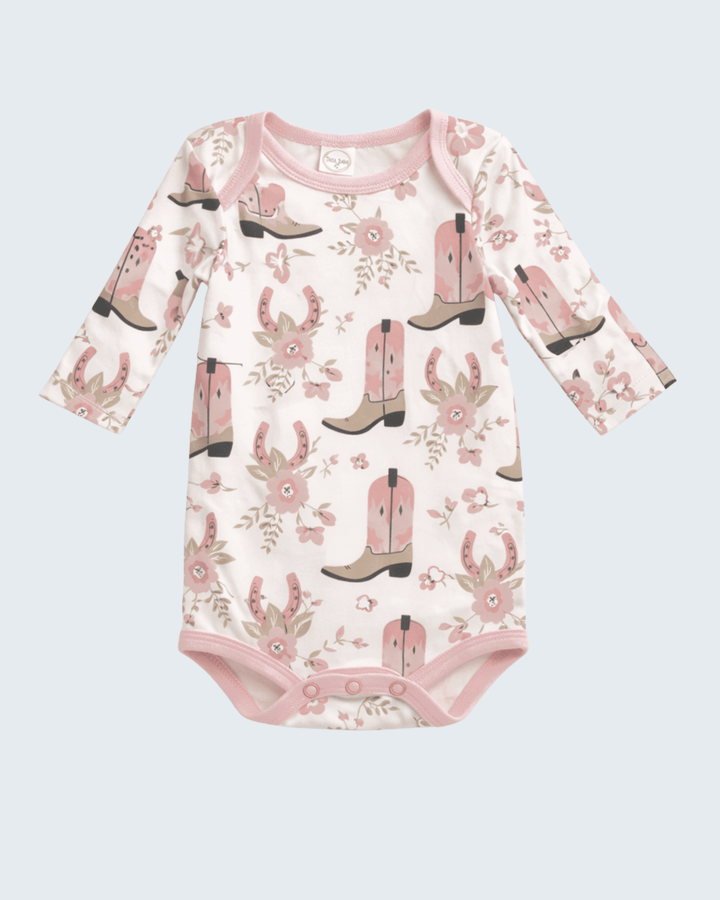 Baby onesie with cowboy boot and floral pattern on a light blue background
