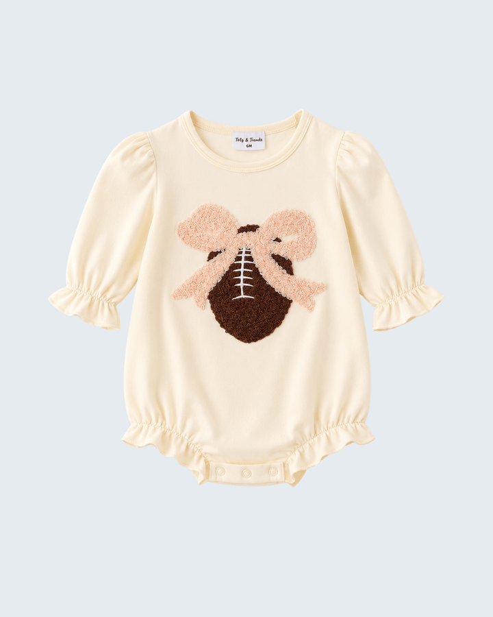 Cream long-sleeve baby romper with football applique, ruffled cuffs and snap bottom