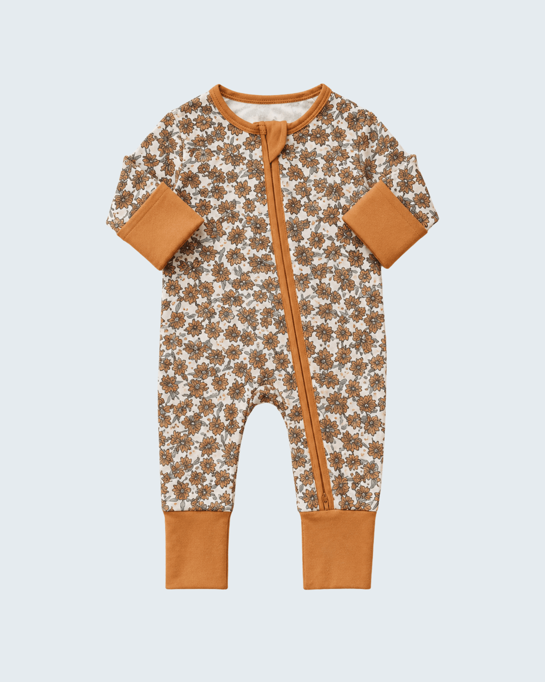 Cream floral bamboo zipper romper with long sleeves, front zip, tan cuffs