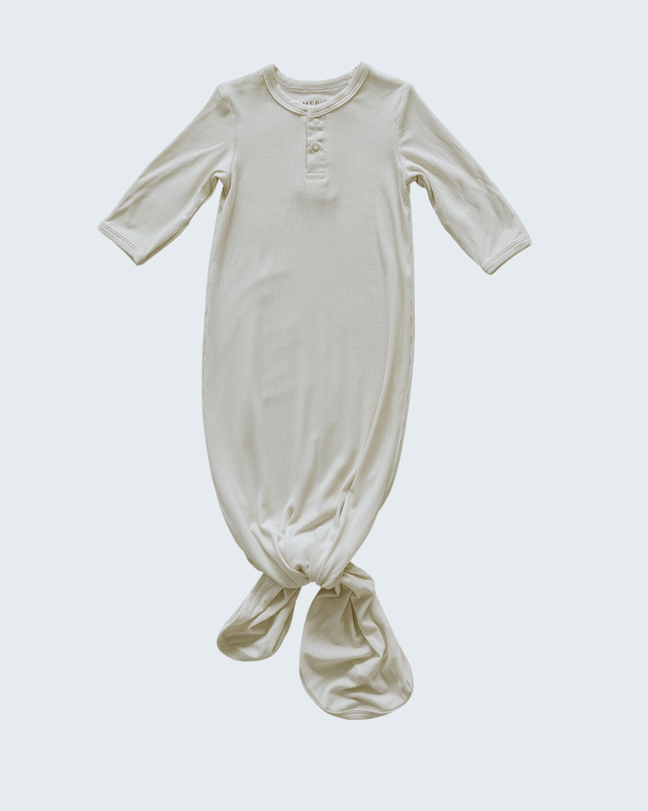 Beige baby gown on a white background