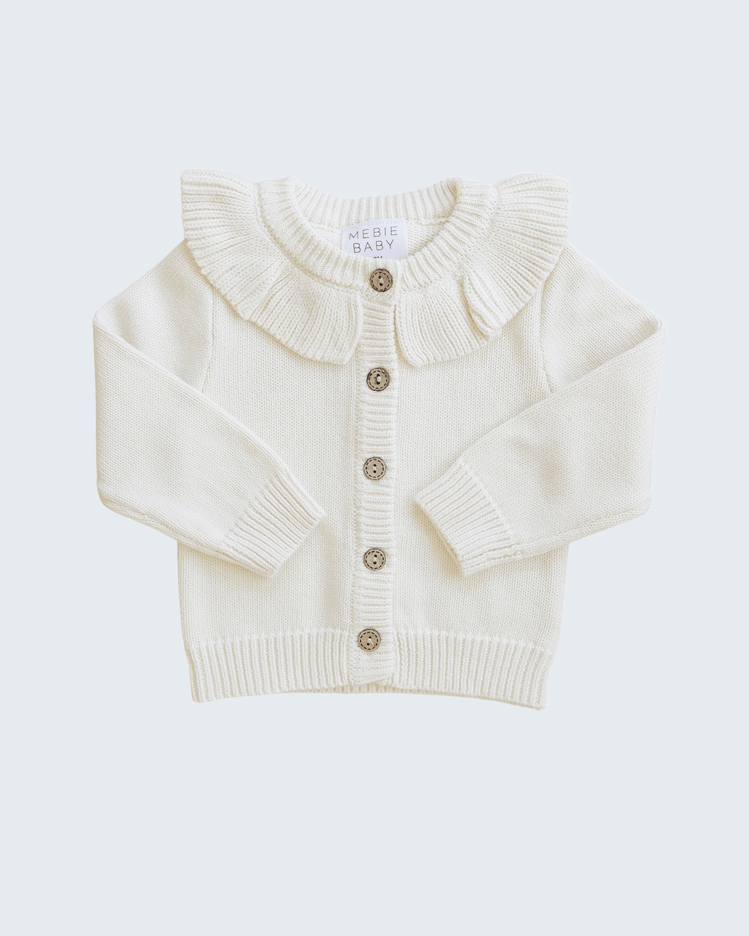 Cream knit cardigan with ruffled collar, button front and ribbed cuffs