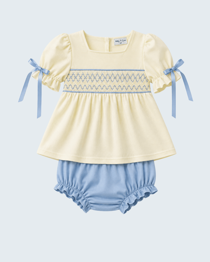 Cream smocked baby dress and blue bloomer set with ribbon bow sleeves