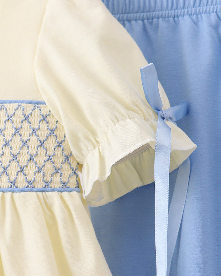 Cream smocked yoke dress top with light-blue bow sleeves