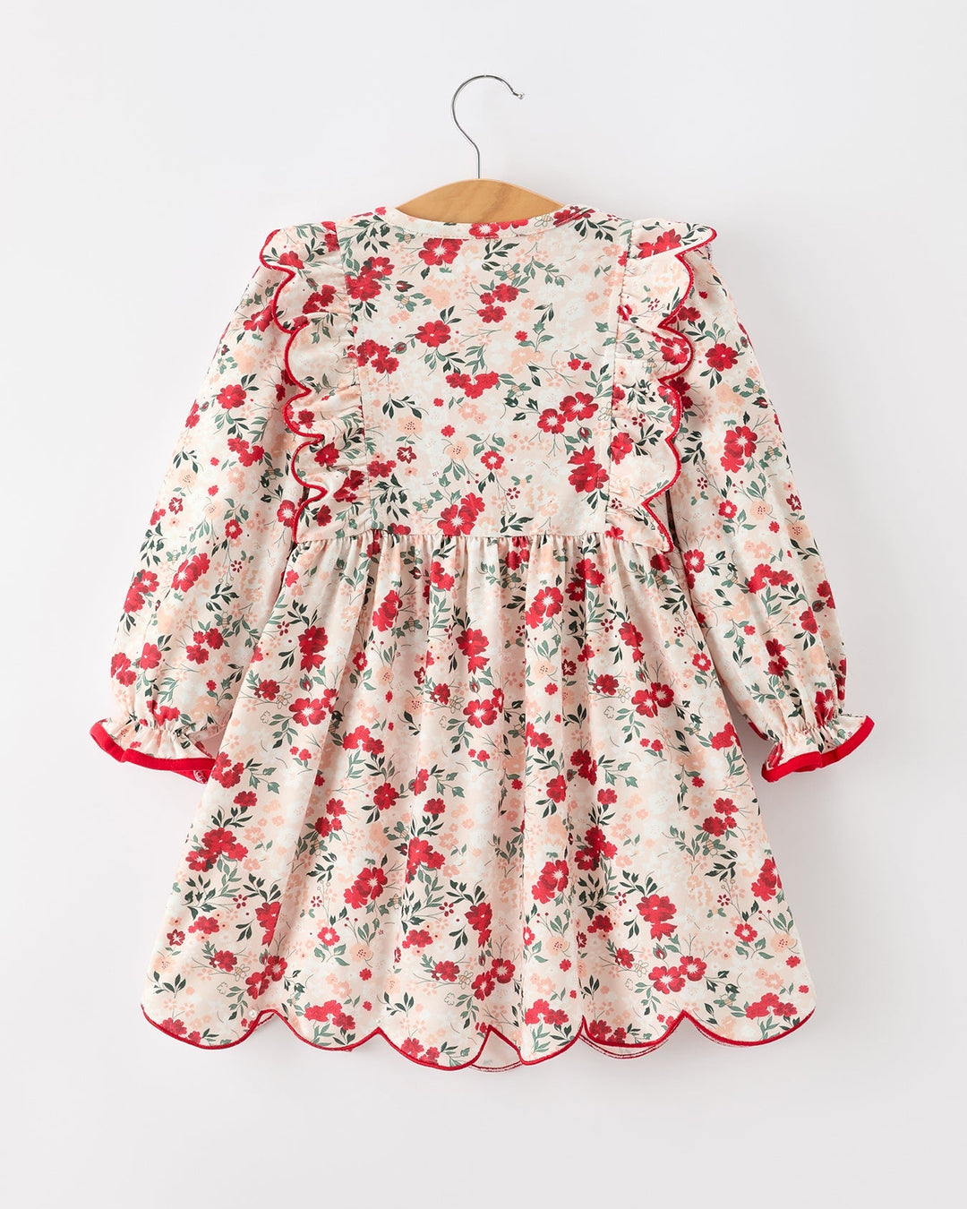 Girls floral twirl dress with gathered skirt and red ribbon ties, long sleeves