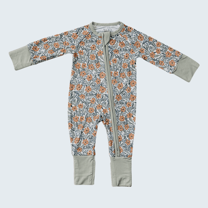 Floral-patterned baby onesie with gray cuffs and hem on a white background