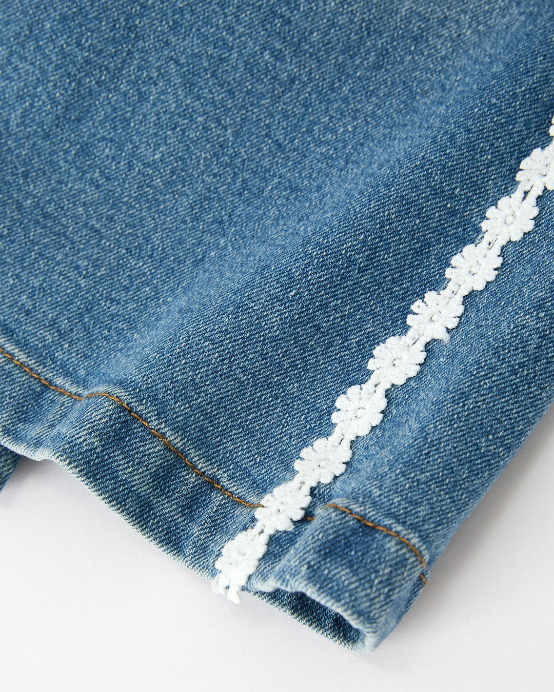 Girls wide-leg denim jeans with white daisy lace trim at cuff