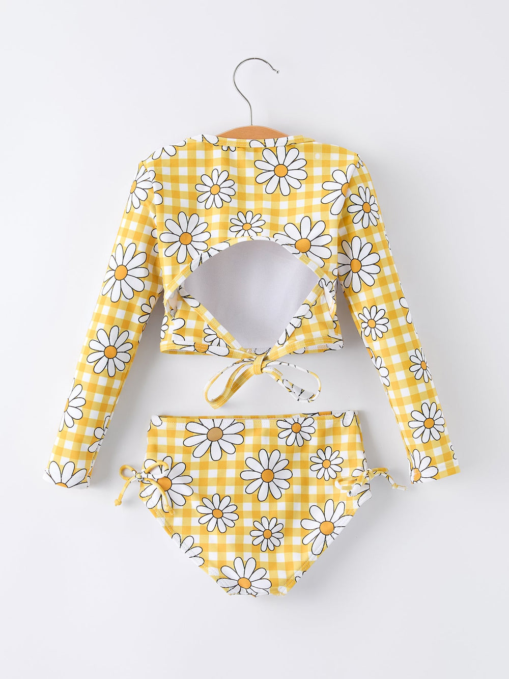 Yellow and white checkered bikini with daisy pattern on a white background