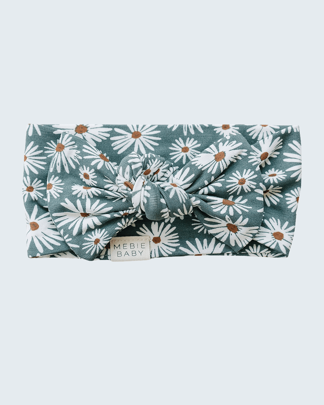 Dark green bamboo head wrap with daisy print and tied knot at center