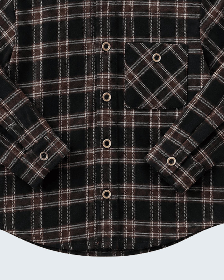 Dark plaid hooded button-up shirt detail: chest patch pocket and button cuffs