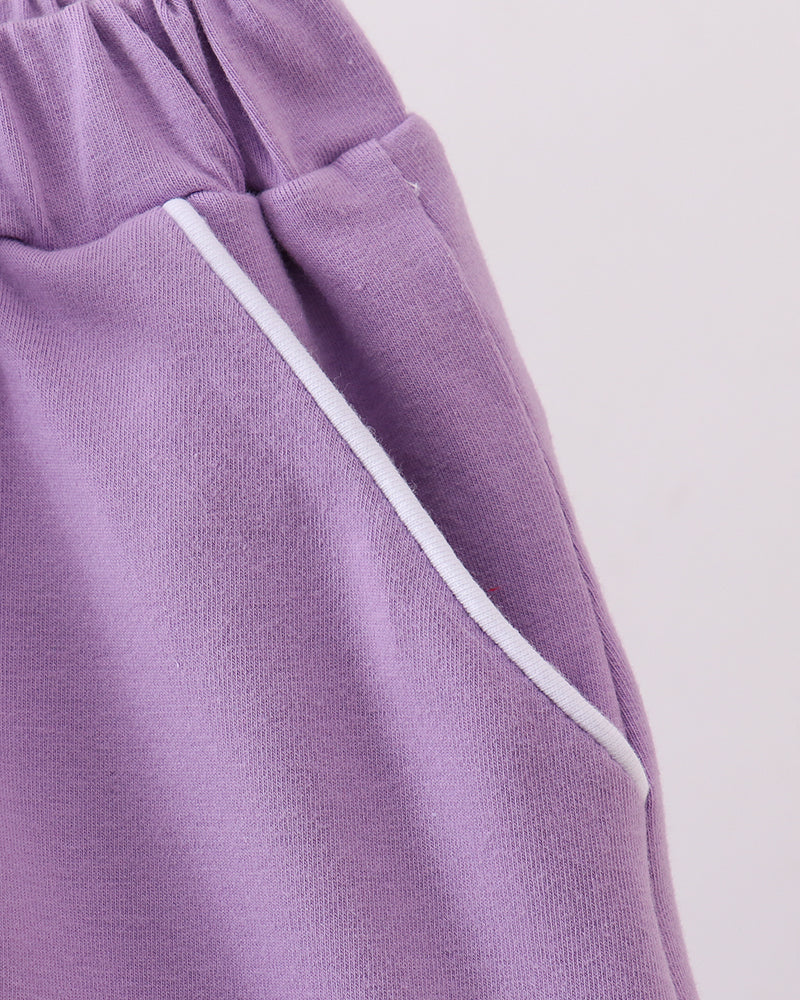 Dark purple skort with contrast white drawstring and side seam detail