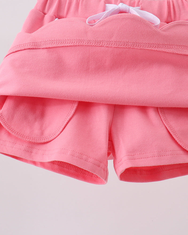 Deep pink skort with scalloped hem and layered front over elastic waist