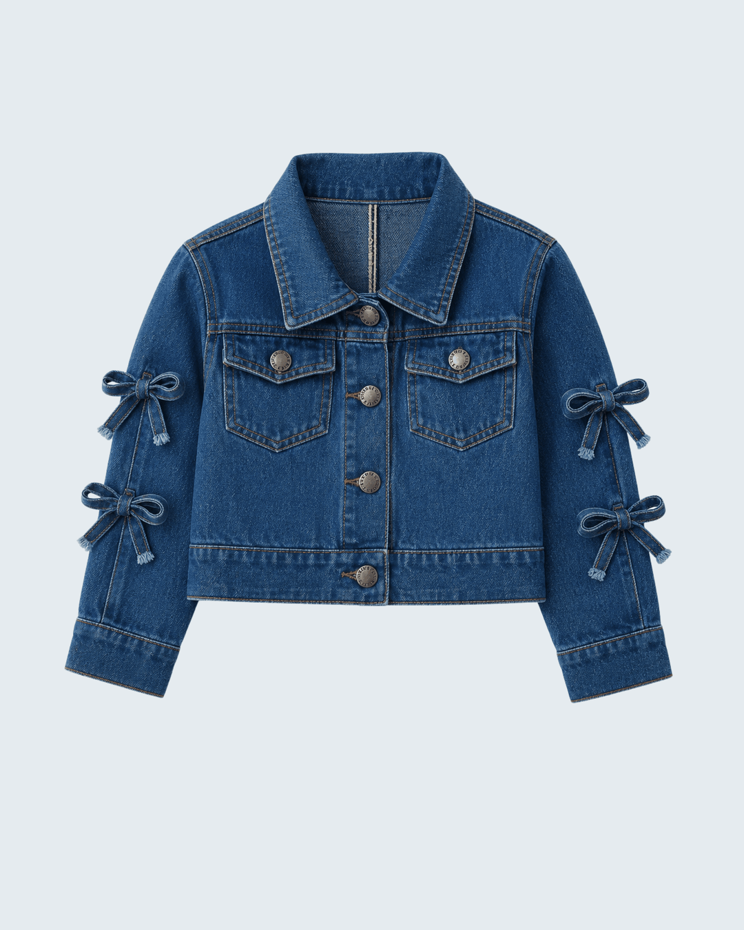 Blue denim cropped jacket with bow sleeve cuffs, button front, chest flap pockets