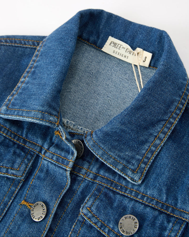 Girls denim jacket collar and button placket close-up