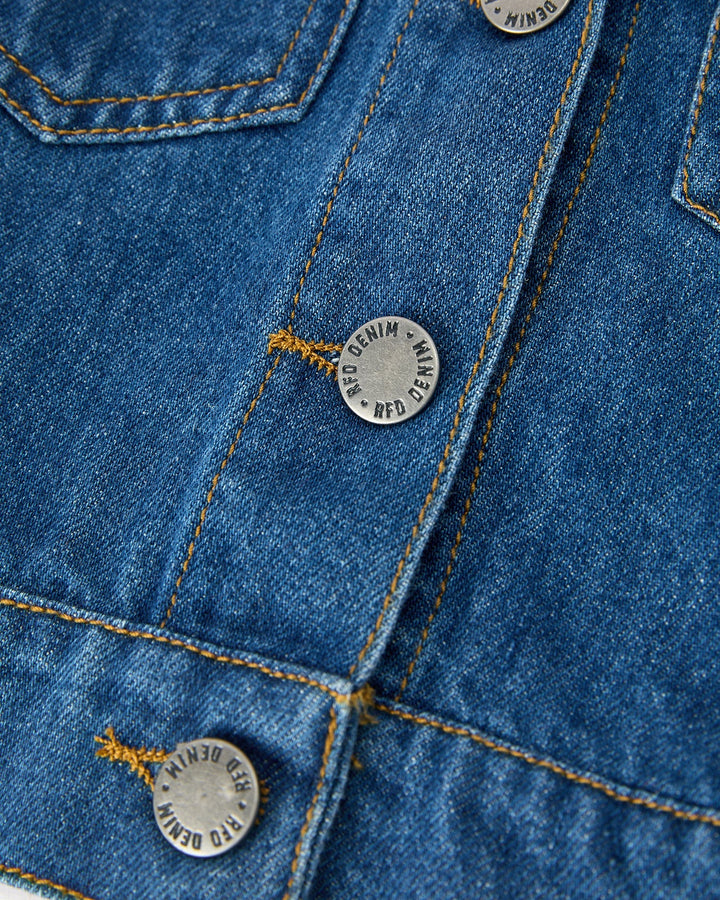 Girls blue denim jacket with round logo buttons and contrast stitching