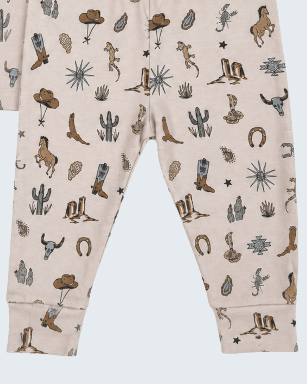 Cream cotton pants with all-over desert animal and cactus print, elastic waistband