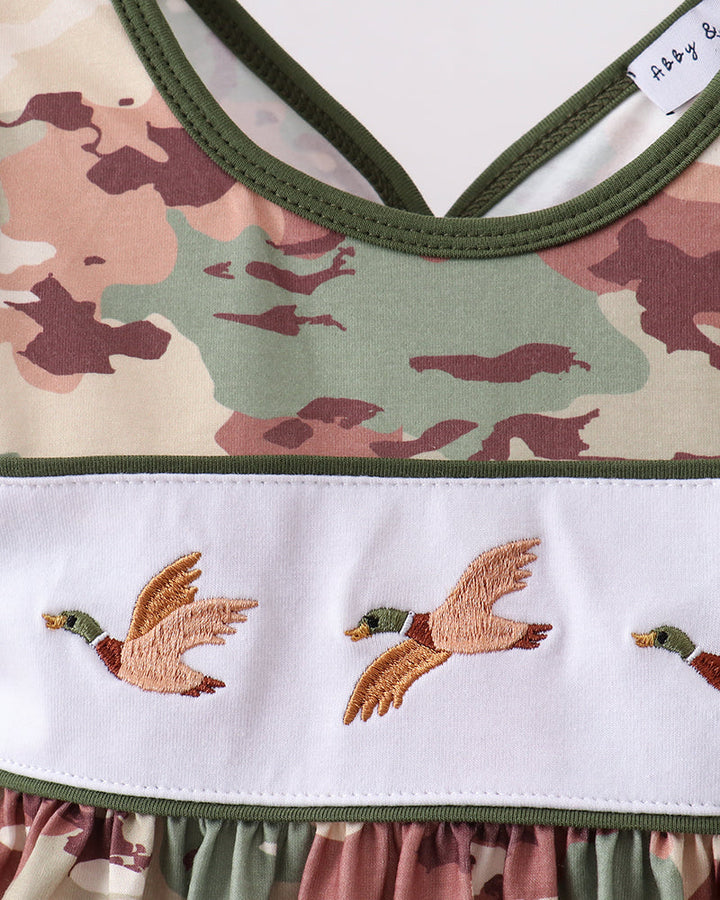 Camouflage-patterned dress with duck embroidery on a white background