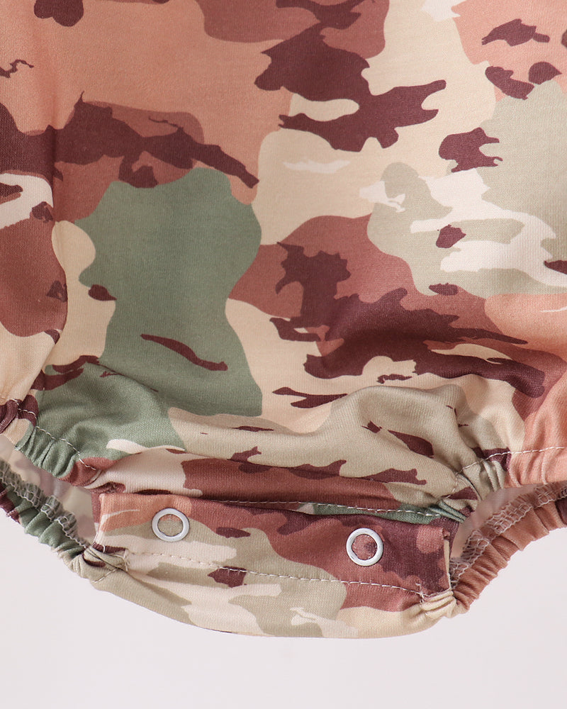 Camouflage-patterned romper on a white background