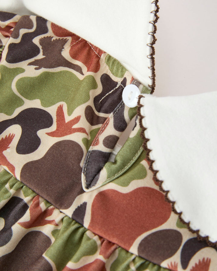 Close-up of a fabric with a camouflage pattern featuring ducks.