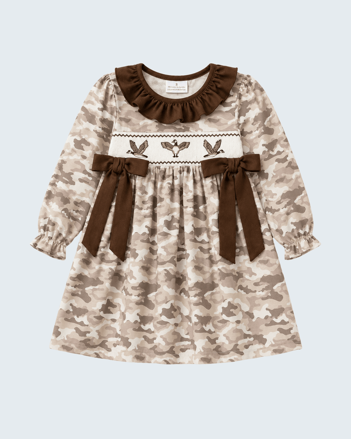 Camouflage-patterned dress with brown accents on a light blue background