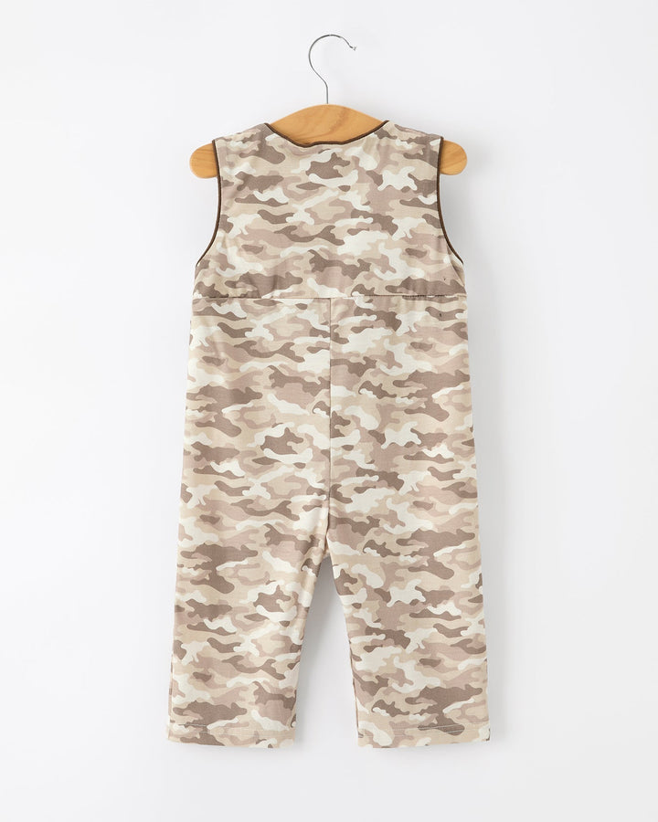 Camouflage-patterned romper on a hanger against a white background