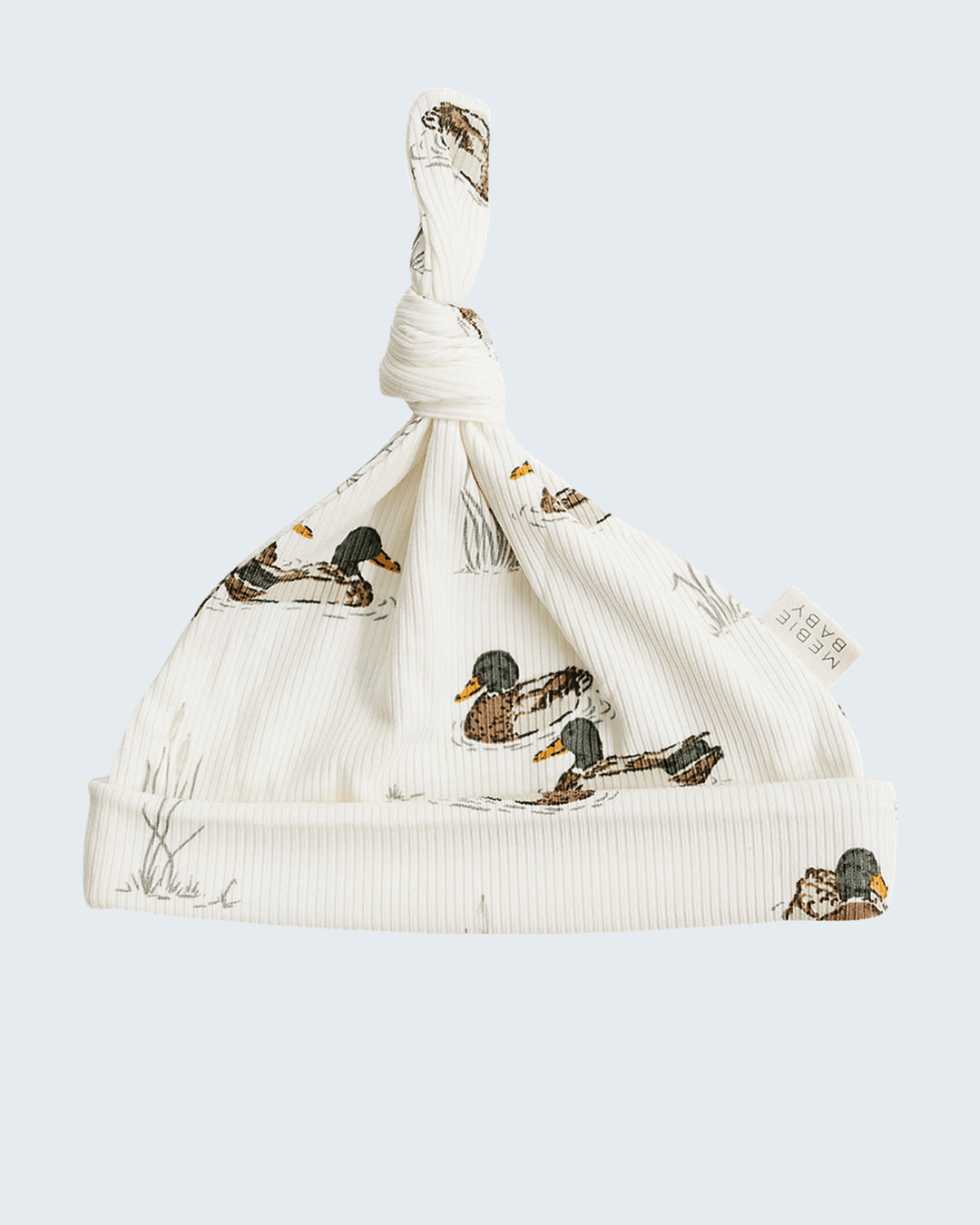 Newborn knot hat in off-white ribbed knit with duck print; gathered knot top