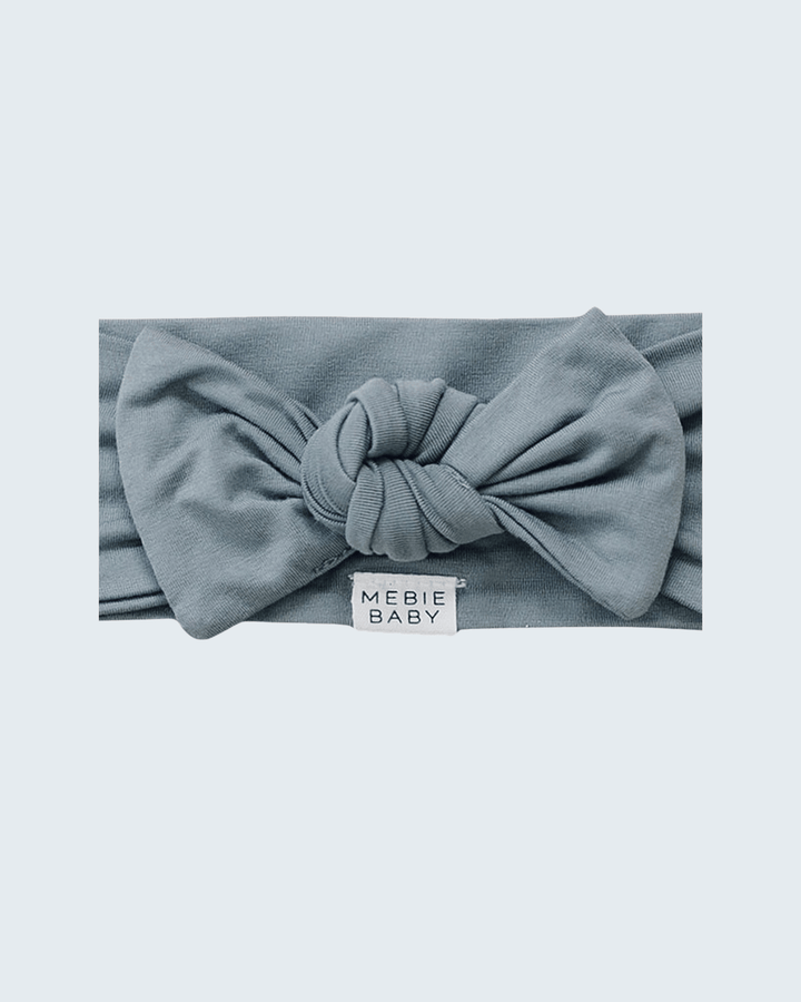 Dusty blue bamboo head wrap with knotted bow and MEBIE BABY label