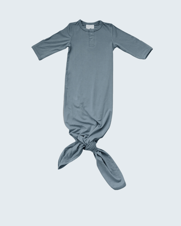 Blue baby knot gown on a light gray background