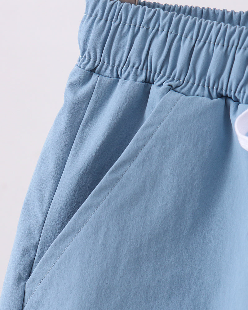 Dusty blue shorts with gathered elastic waistband and side seam pleats