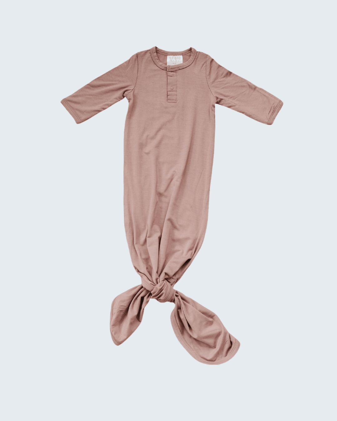 Pink baby knot gown on a light gray background