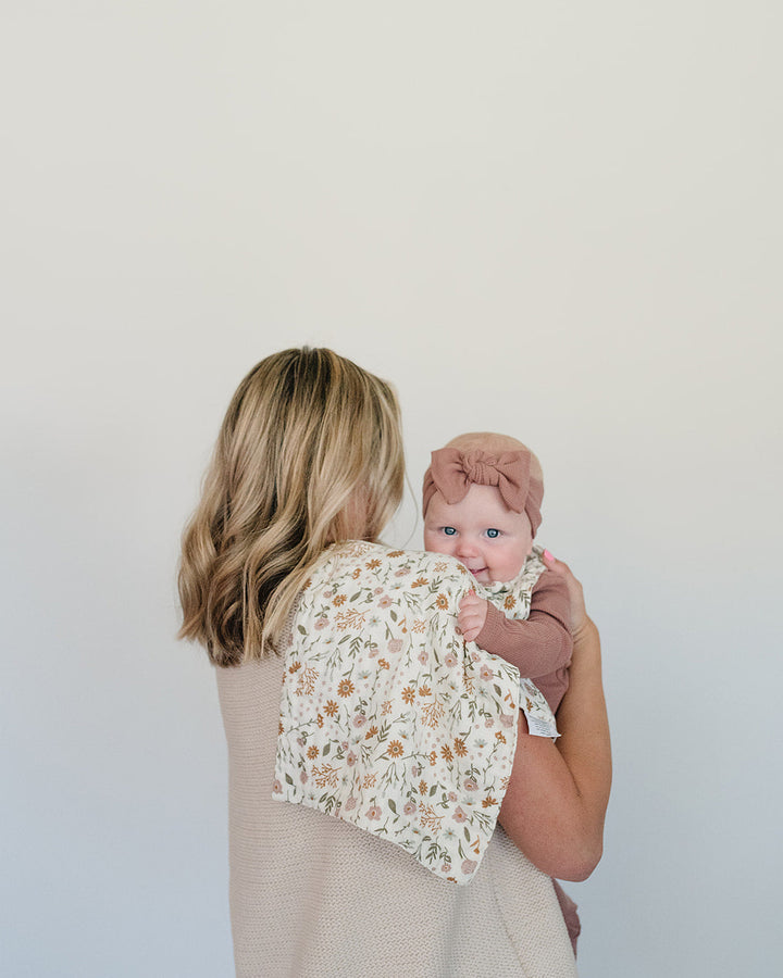 Dusty rose ribbed head wrap on baby worn while held